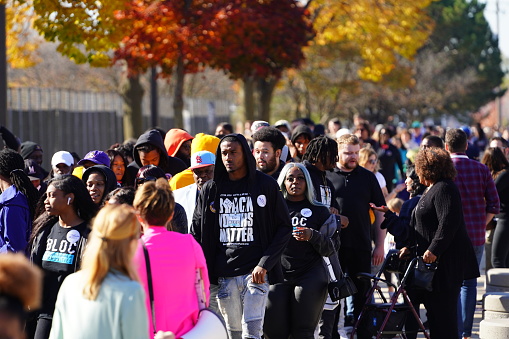 Milwaukee, Wisconsin USA - October 29th, 2022: Many Democrat voters lined up at North Division High school to participate at Governor Tony Evers, Mandela Barnes and Barack Obama Democratic party rally.