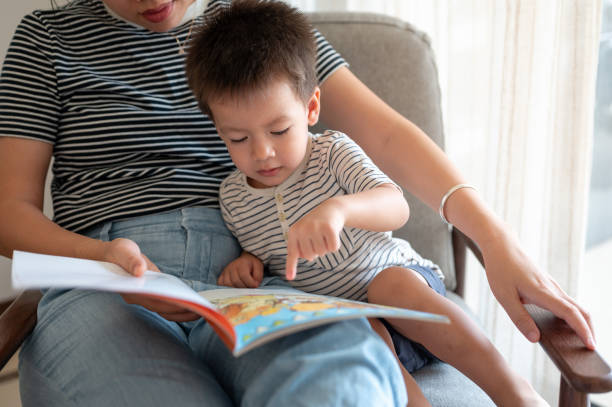 istock Gentle mother is reading a book with her little boy 1678893915