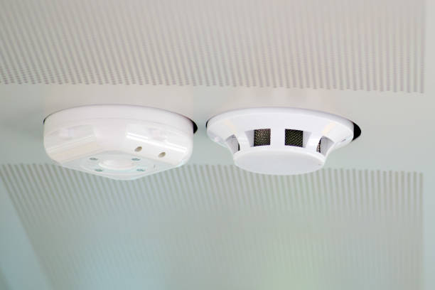 istock Fire alarm system on a white ceiling, close up of smoke detector 1678920566