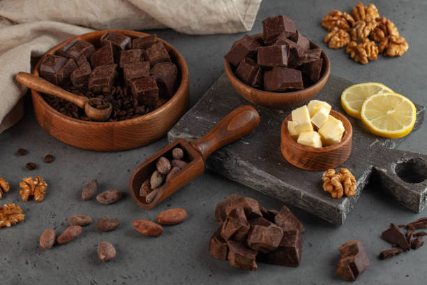 istock Assorted pieces of chocolate, cocoa beans on a grey background. Handmade chocolate. 1678927558