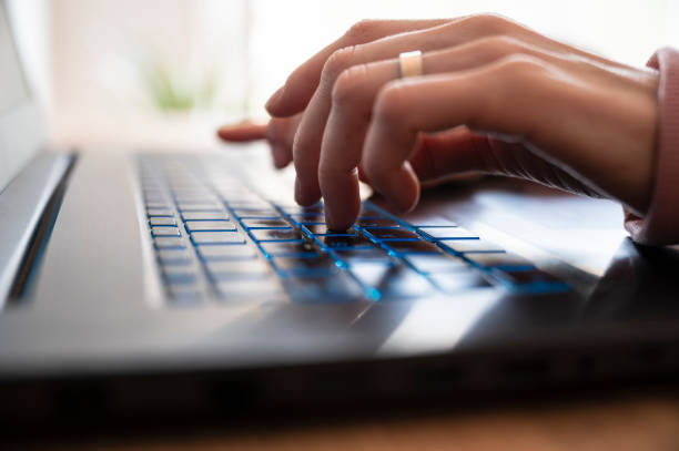 istock Low angle closeup view of female hands typing using laptop computer 1678927603