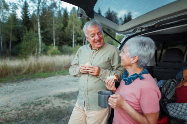 istock Romantic Senior couple enjoying coffee in nature 1678941526