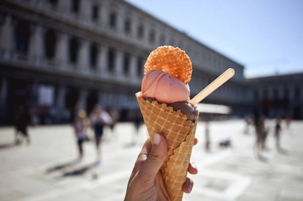 istock strawberry and chocolate ice cream cone in Venice. 1678949828