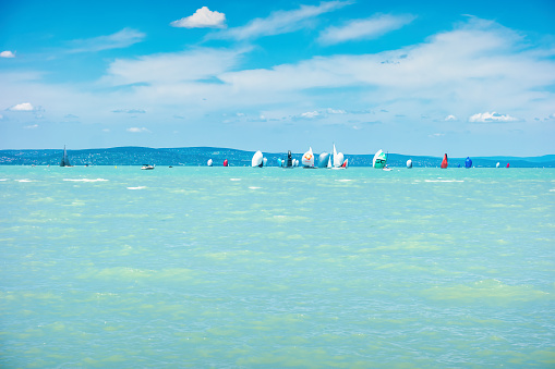 Sailboats take part in the annual Blue Ribbon race in Lake Balaton in the town of Siófok, Hungary on a sunny day.
