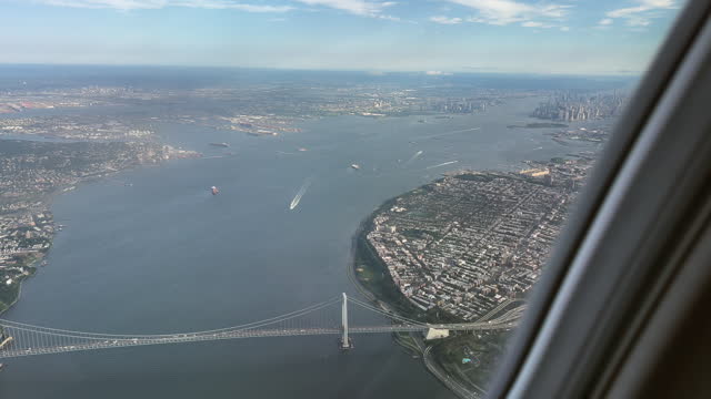 New York Harbor and Verrazzano Bridge from Airplane Window POV