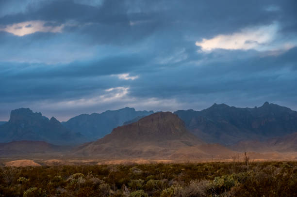 istock Nugent Mountain With Silhouetted Chisos Mountains In The Distance 1679011936