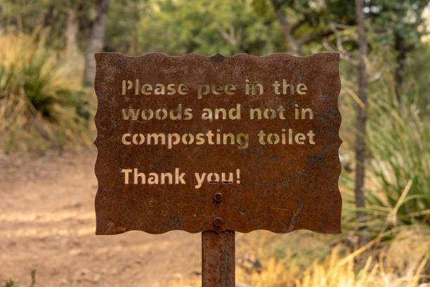 istock Please Pee in the Woods Sign 1679016085