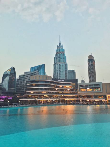 The Dubai Mall A view of The Dubai Fountain and the Dubai Mall from Souk Al Bahar, Dubai, United Arab Emirates. •29 Jan 2019• dubai mall stock pictures, royalty-free photos & images