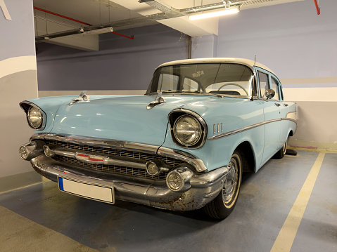 Westlake, United States - October 21, 2017: Front side view of an aqua color 1957 Chevrolet Bel Air convertible classic car.