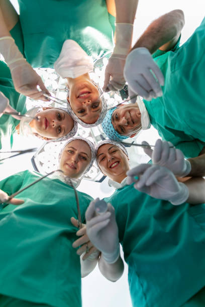 istock Team of nurses and surgeons in surgery. 1679061067
