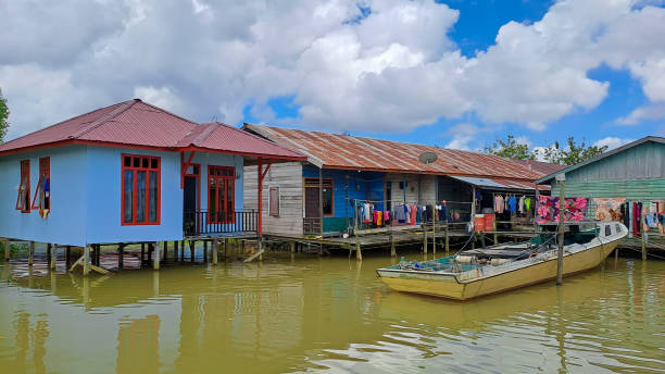 istock wooden house on the river 1679171590