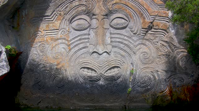 New Zealand Maori Stone Carvings At Taupo Lake. Slow Zoom In On Face.