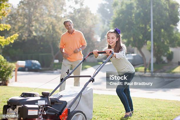 Father And Daughter Mowing Lawn Together Stock Photo - Download Image Now - Mowing, Mature Men, Child