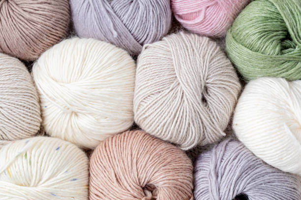 istock Craft knitting hobby background with yarn in natural colors 1679210338