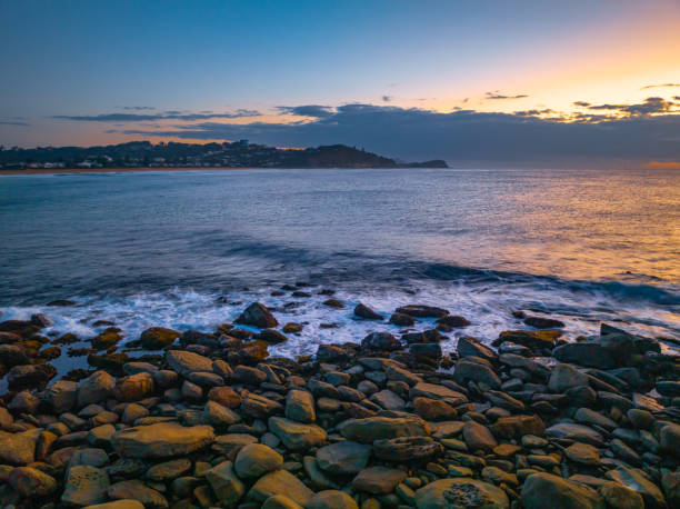 istock Sunrise over the ocean with low clouds on the horizon 1679263441