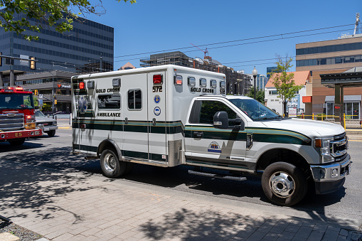A Gold Cross Ambulance on the street. Salt lake City, UT, USA, June 26, 2023. Gold Cross Ambulance provides emergency medical transport service