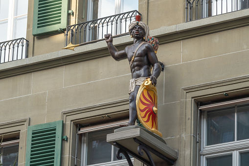 Bern, Switzerland - Nov 25, 2019: Blackamoor Sculpture at Guild House of the Moor Facade - Bern, Switzerland