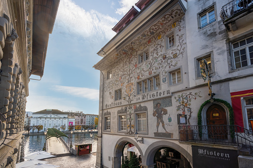 Lucerne, Switzerland - Nov 27, 2019: Fresco of Pfistern Guild Hall at Kornmarkt Square - Lucerne, Switzerland