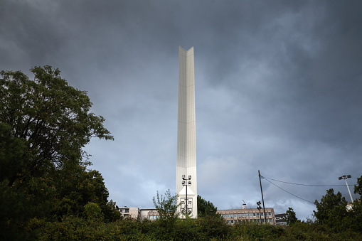 Baltimore, USA - February 18, 2024. Monument to George Armistead with a lady walking dogs on left at Federal Hill Park, Baltimore, Maryland, USA