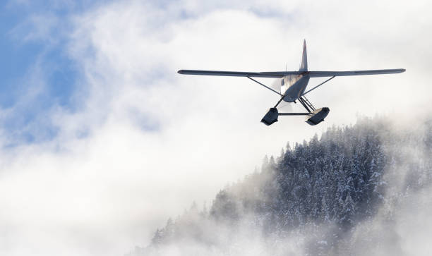 istock Floatplane flying over the Canadian Mountain Landscape. Adventure Composite 1679321484