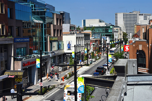 Halifax, Canada - August 2, 2023:  Spring Garden Road, a vibrant street with many pubs, restaurants, stores and a mall in Halifax.  It is a popular destination for locals and tourists.