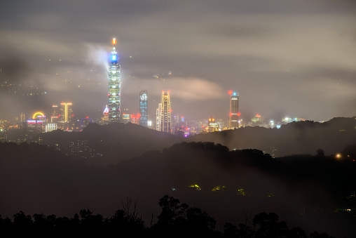 On the eve of the typhoon, fast-moving clouds and fog enveloped the entire city. Clouds, lights and architecture combine to create a dreamlike landscape.