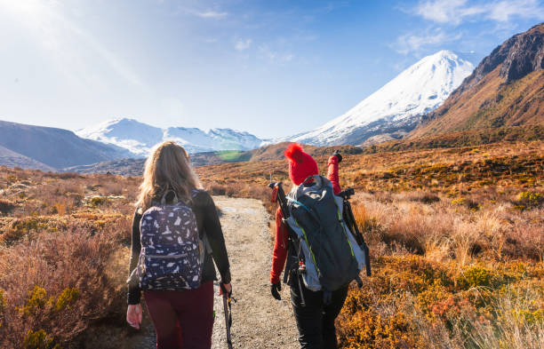 Hikers doing Tongariro crossing on a nice sunny day in Tongariro National Park, North Island, New Zealand.
