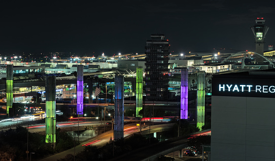 City of Los Angeles, California, United States: Los Angeles International Airport, night scene, looking west. LAX Gateway Kinetic Light Pylons are shown in the foreground.