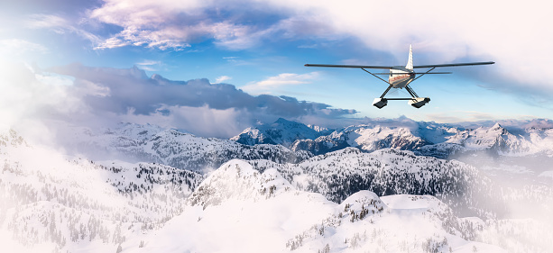 Seaplane flying over the Rocky Mountains. Aerial Landscape from BC, Canada near Squamish and Vancouver. Epic Adventure Composite. 3D Rendering Airplane