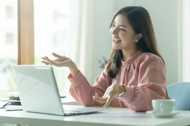 istock Confident businesswoman having pleasant conversation, explaining work detail on video conference with coworkers via laptop. 1679506399
