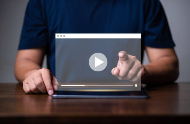 istock multimedia player and online streaming concept, man watching online show or tutorial on video streaming website,music video. 1679516052