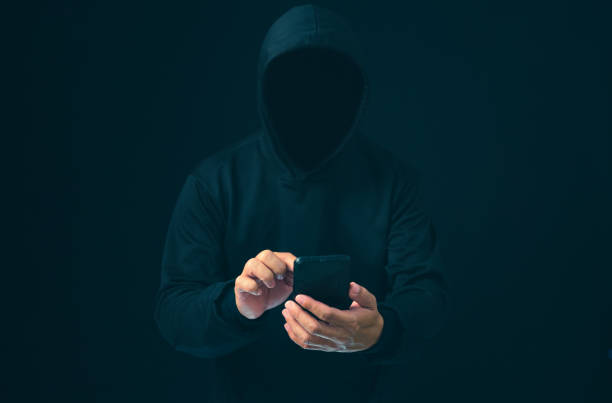 istock Hackers work on phone in the dark. The concept of information security in the Internet network and information espionage. Virus attack. Hacker attack. 1679540333