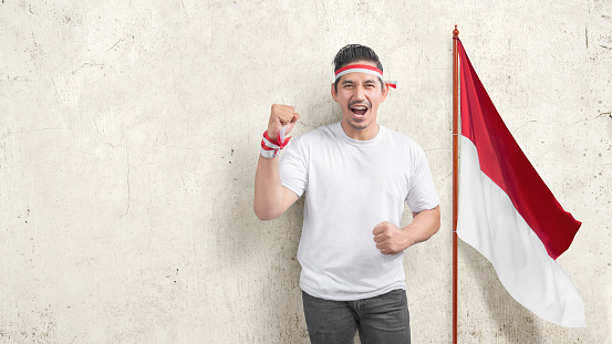 Indonesian men celebrate Indonesian independence day on 17 August. Indonesian independence day