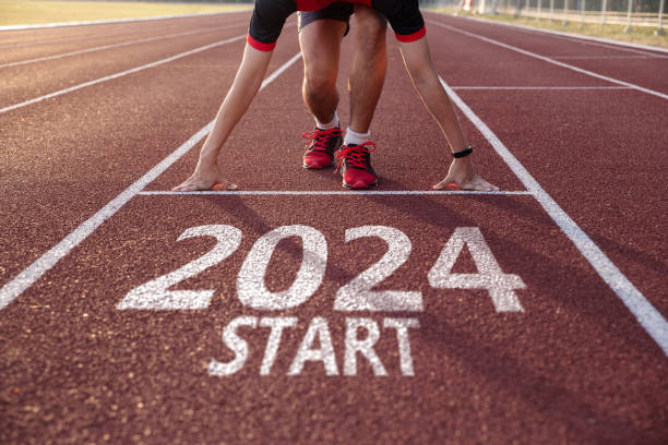 istock Young man ready to run preparing for 2024 goals. 1679580557