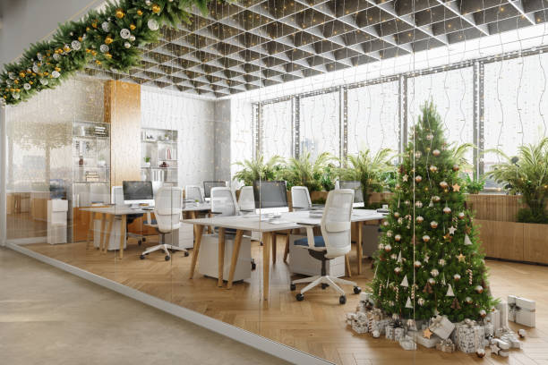 istock Outside View Of Eco-Friendly Open Plan Modern Office With Christmas Tree, Ornaments, Gift Boxes, Tables, Office Chairs And Plants 1679580753