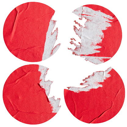 Round red paper stickers with torn edge on white background with clipping path