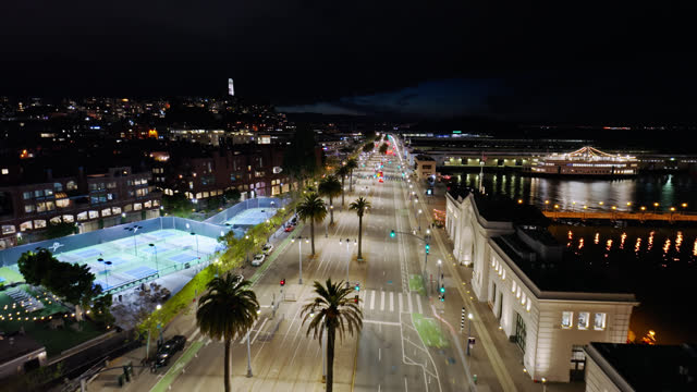 Drone Flight Over the Embarcadero Towards Coit Tower at Night