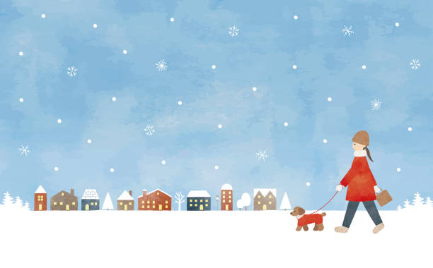 istock Woman walking dog snowy town 1679587482