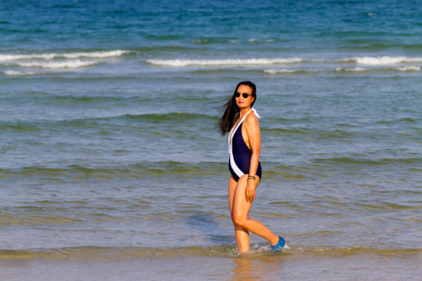 istock Woman body beautiful with bikini relax on beach 1679654910