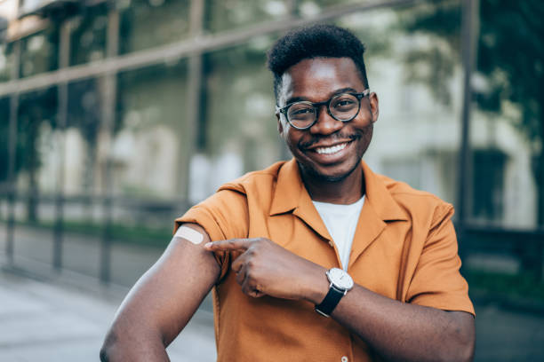 Man showing his arm after getting vaccinated.