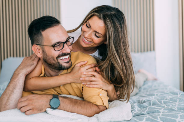 istock Couple relaxing in bedroom. 1679665454