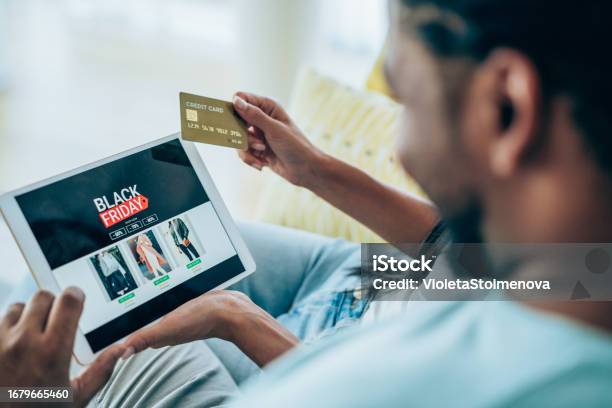 Couple Shopping Online On Black Friday Stock Photo - Download Image Now - Black Friday - Shopping Event, Shopping, Credit Card