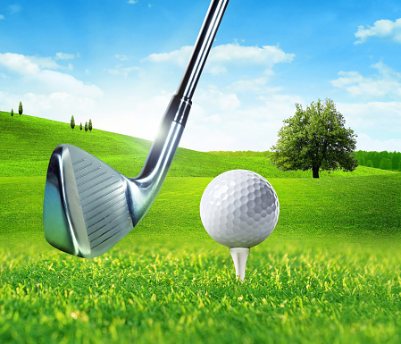 Golf Club, Ball and Tee on grass,isolated on white.