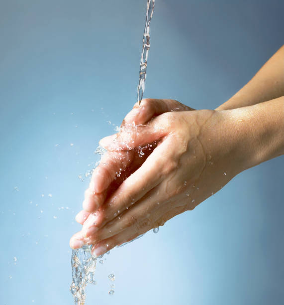 istock Closeup washing hand under water 1679706792