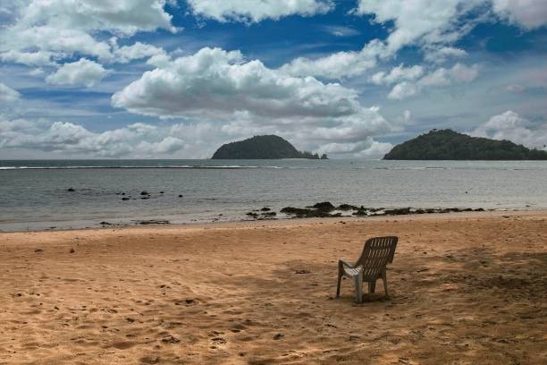 istock Seat at the beach with cloudy sky and island 1679719472