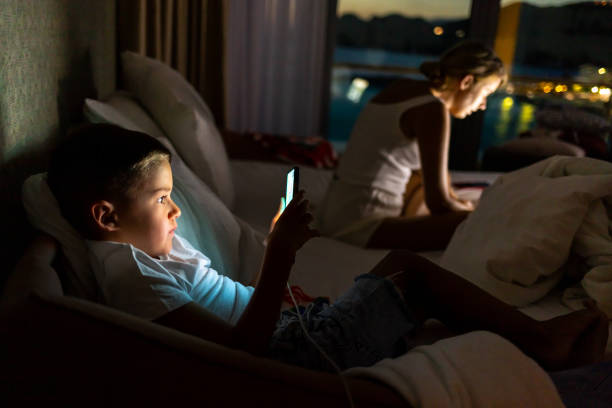 istock Mother with boy using laptop and smartphone. 1679723276