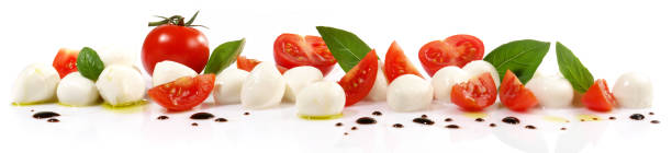 istock Tomato Mozzarella Panorama with Basil isolated on white Background 1679729098