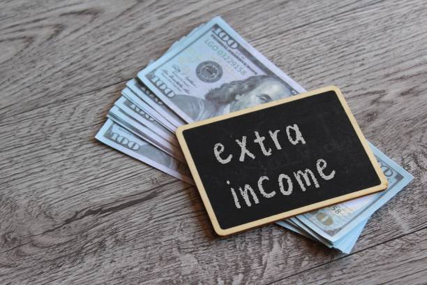 istock Top view image of money and chalkboard with text EXTRA MONEY. 1679732739