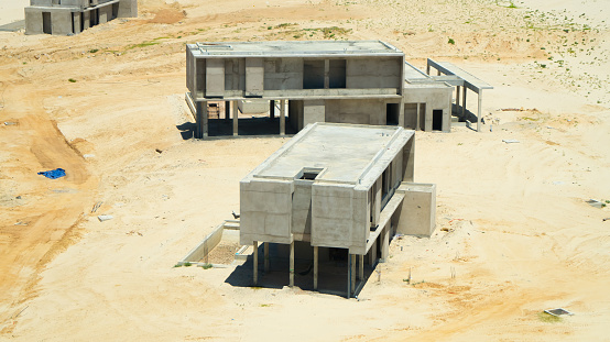 Construction of a bungalow of a new hotel in Cam Ranh in Vietnam in the sand dunes.