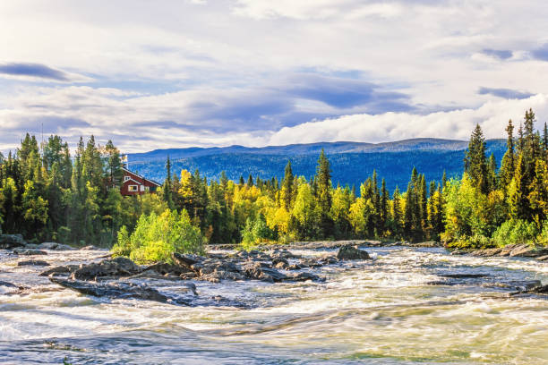 istock Kvikkjokk mountain station by a rapid river in autumn 1679740519